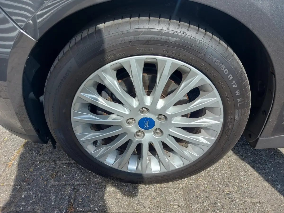 1.0 Titanium, airco,cruise,navigatie/camera,stoel/stuurverwarming,voorruit verwarmd,parkeersensoren,