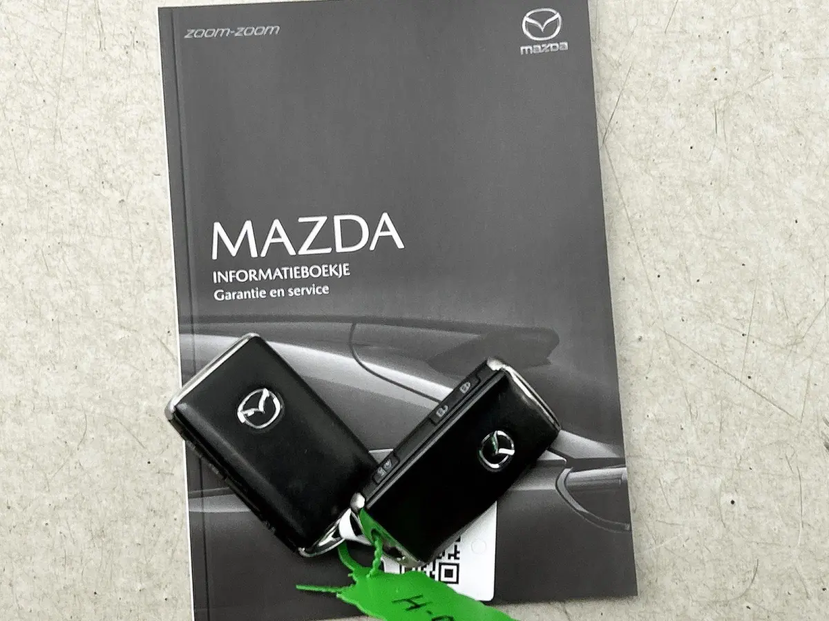 2.0 SkyActiv-G 165 Homura Limited | HEAD-UP | NAVIGATIE | CAMERA | STOEL-STUURWIELVERWARMING | DRAADLOZE TELEFOONLADER