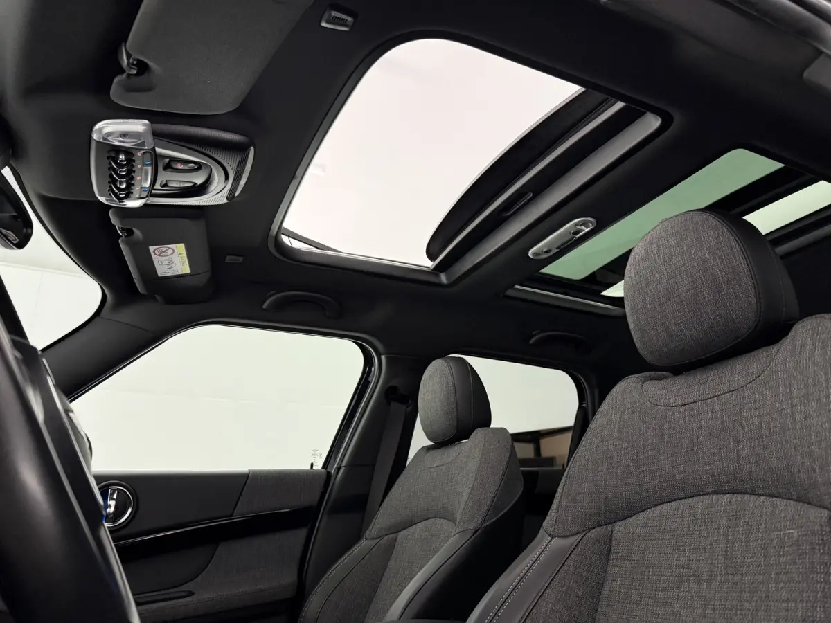 2.0 Cooper ALL4 Chili | Pano | Sfeer | Clima | Cruise | Carplay | Keyless | Parkeersens.