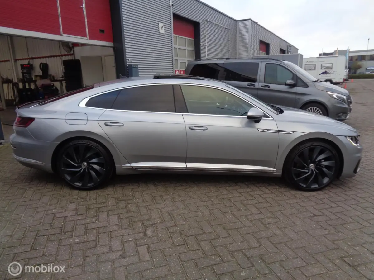 2.0 TSI Business R-Line/ DSG-7/Pano/DCC/Stoeverw/ 20'' Lm velgen/FULL LED/Afn trekhaak/Camera/Airco/nieuwstaat