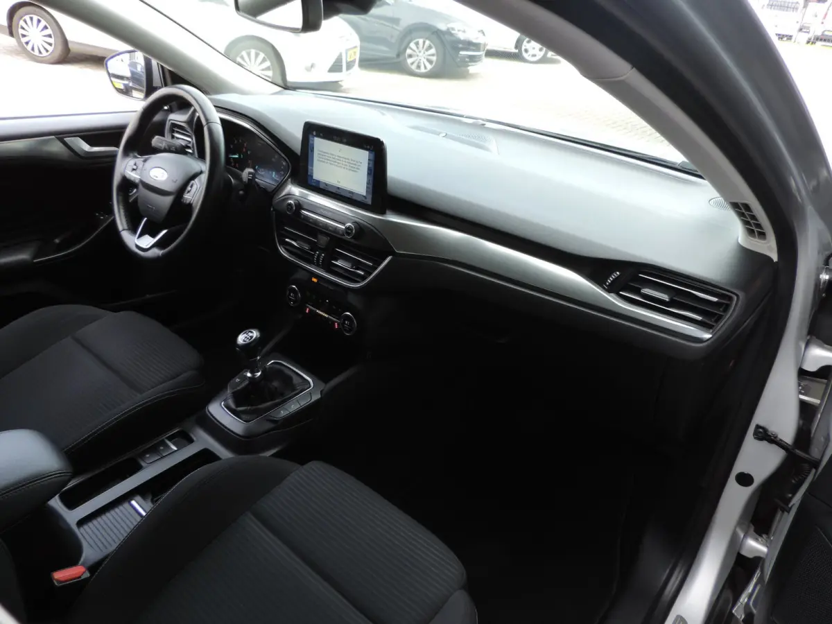 1.0-T 125PK Titanium Business | LED koplamp | Winterpack | Camera | Adapt.cruise | PDC v+a | CarPlay | Priv.glas | ECC