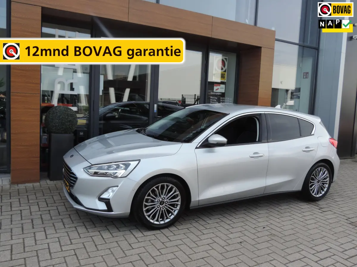 1.0-T 125PK Titanium Business | LED koplamp | Winterpack | Camera | Adapt.cruise | PDC v+a | CarPlay | Priv.glas | ECC