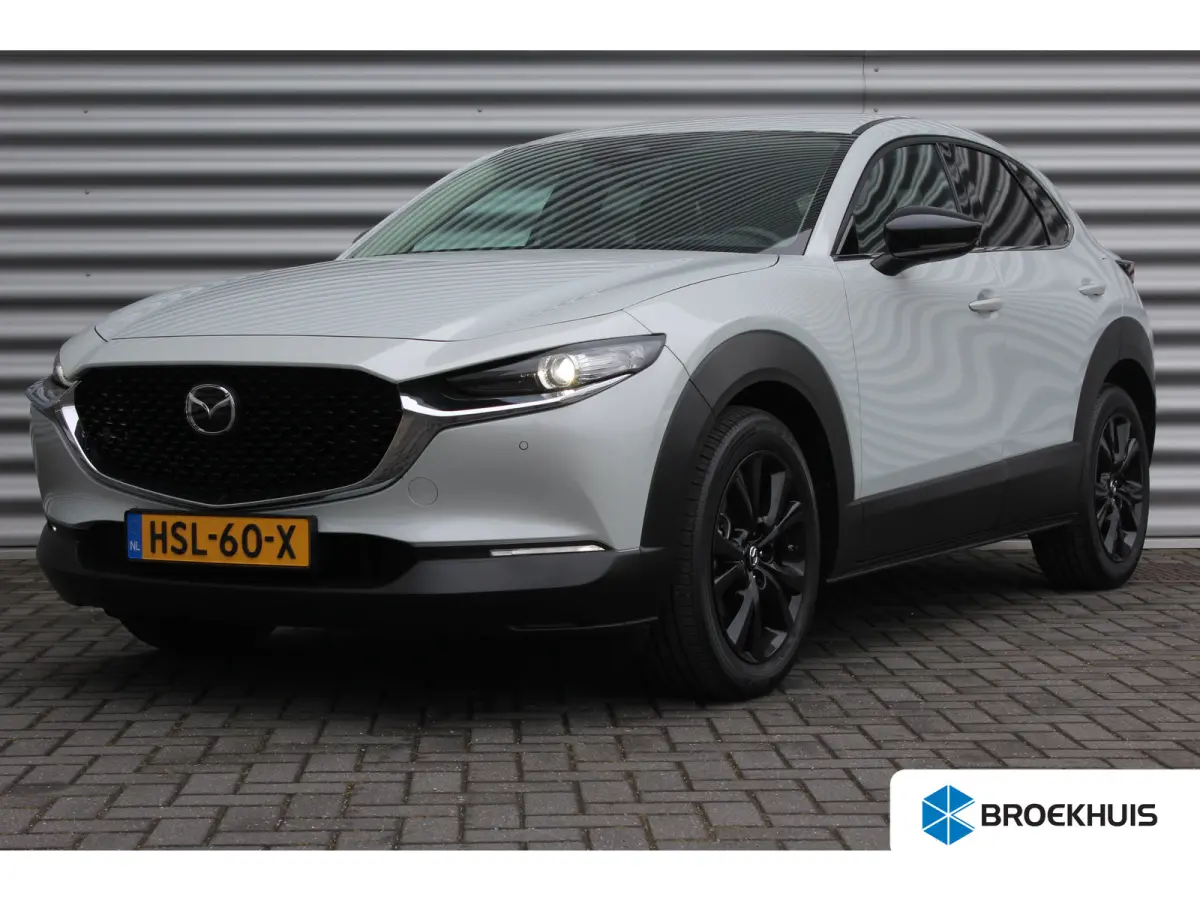 2.5 e-SKYACTIV-G M HYBRID 140PK HOMURA AUTOMAAT / NAVI / CLIMA / FULL-LED / PDC / 18" LMV / KEYLESS / AFN. TREKHAAK / WINTERPAKKET / ADAPT. CRUISECONTROL / 1E EIGENAAR / NIEUWSTAAT !!
