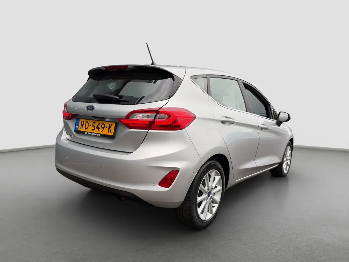 1.0 100pk EcoBoost Titanium | Camera | Adaptive cruise controle | B&O Audio | Voorruitverwarming | Carplay | Parkeersensoren voor en achter | Navigatie | Climate controle