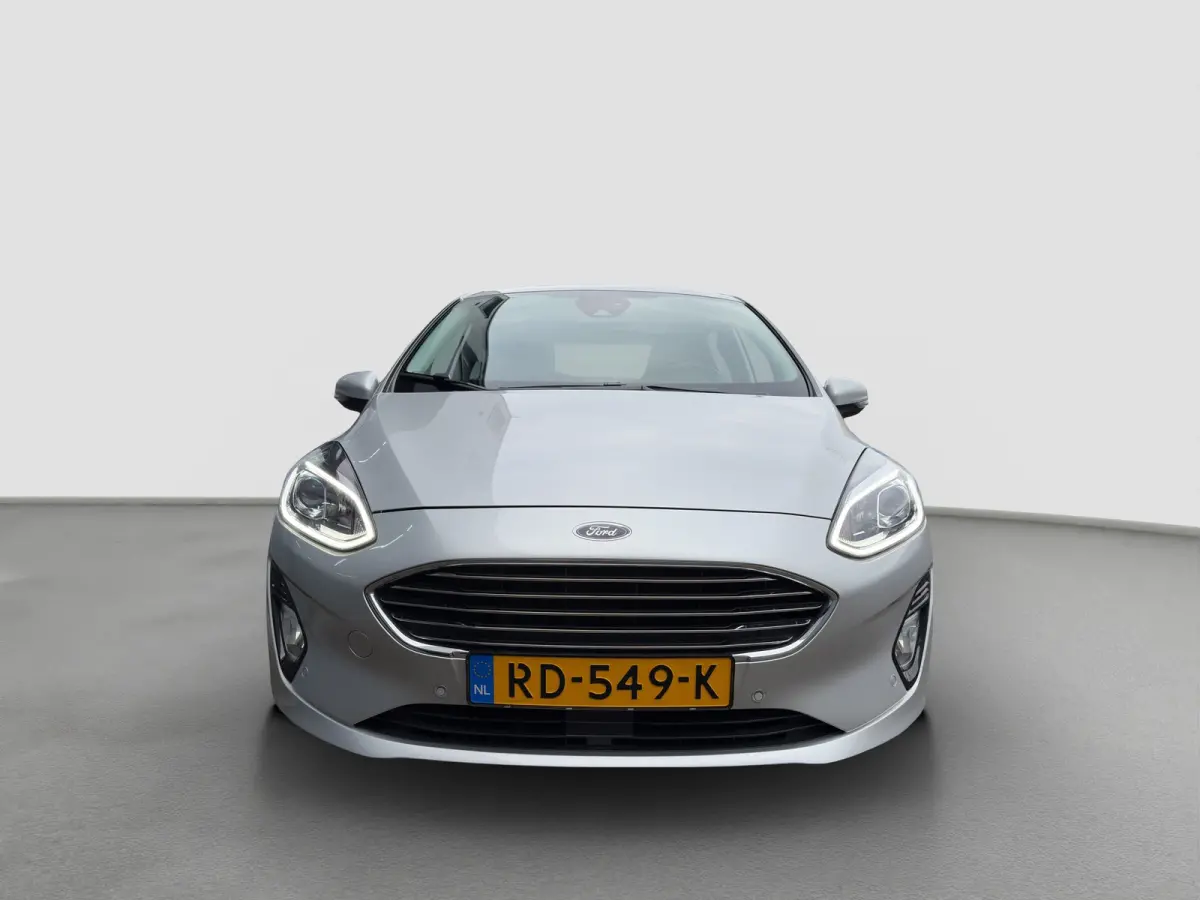 1.0 100pk EcoBoost Titanium | Camera | Adaptive cruise controle | B&O Audio | Voorruitverwarming | Carplay | Parkeersensoren voor en achter | Navigatie | Climate controle