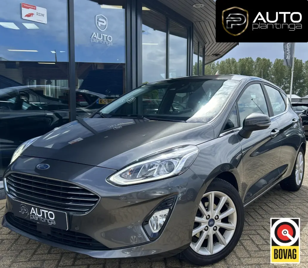 1.0 EcoBoost Titanium 101PK | 1e Eigenaar! | Dealeronderhouden | NL AUTO | AUTOMAAT | Trekhaak | Achteruitrijcamera | B&O Audio | Navigatie | Climate Control | Adaptive Cruise Control | Voor