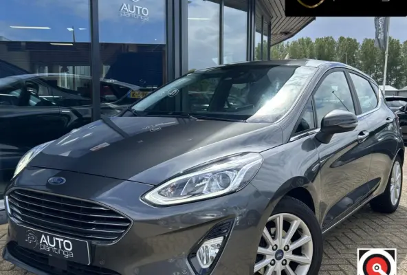 1.0 EcoBoost Titanium 101PK | 1e Eigenaar! | Dealeronderhouden | NL AUTO | AUTOMAAT | Trekhaak | Achteruitrijcamera | B&O Audio | Navigatie | Climate Control | Adaptive Cruise Control | Voor