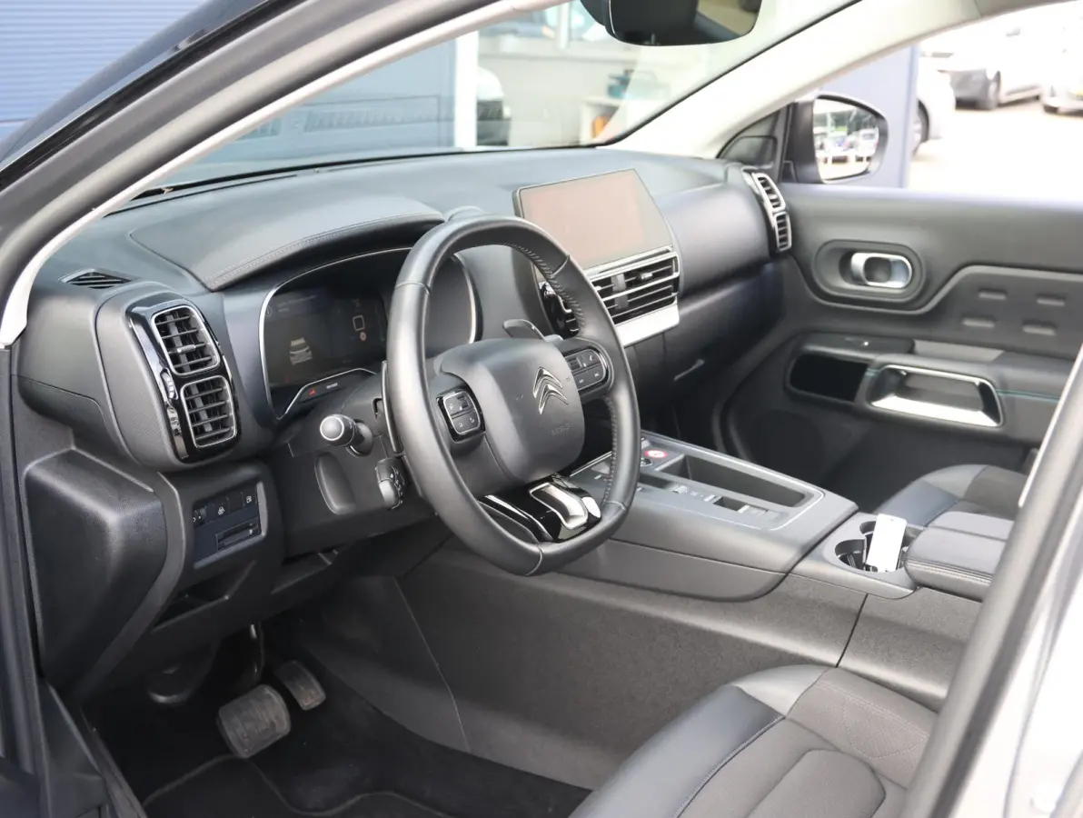 225pk Plug-in Hybrid Feel | 1ste eigenaar | Camera | Dodehoekdetectie | LED lampen | LEER/Stof | 18"LMV | AUTOMAAT