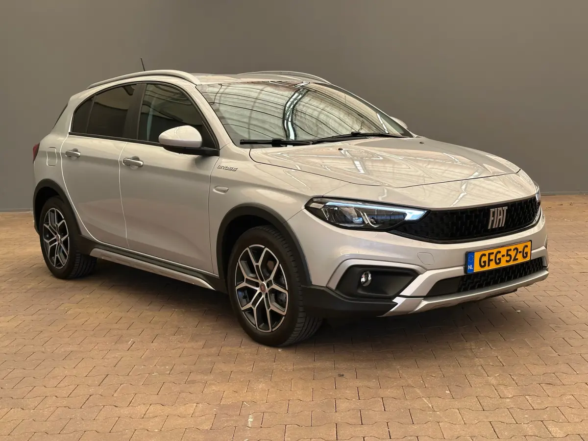 1.0 Cross Camera | Keyless | Navigatie | 17" Lichtmetaal | Climate | Adpatieve Cruise | Carplay | Achteruitrijcamera | Airco (automatisch) | Armsteun voor