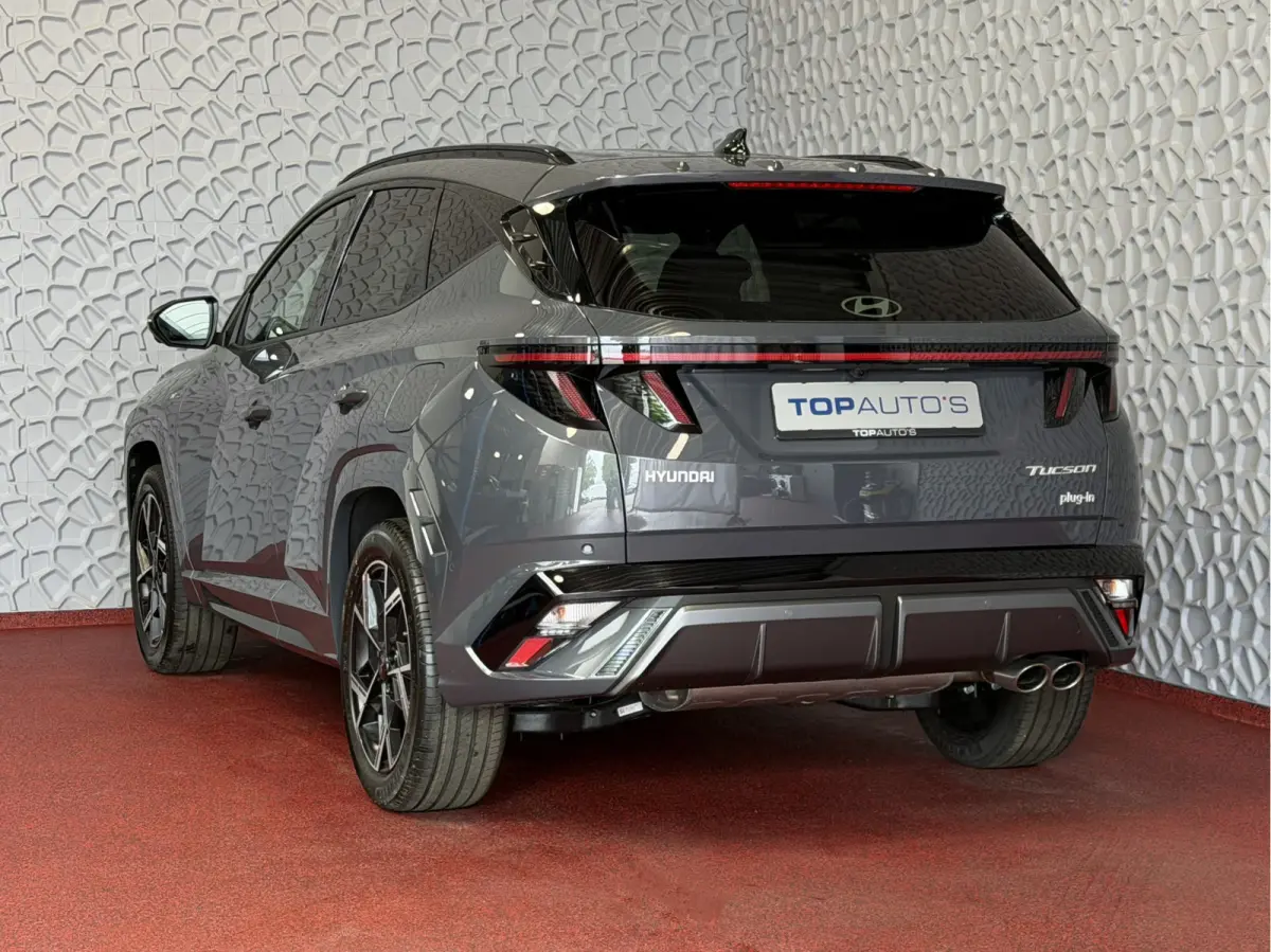 ONGEBRUIKTE AUTO 1.6 T-GDI PHEV N-LINE CAMERA ELEK.KLEP ELEK.STOEL/GEHEUG.VERW/GEKOELD SUBWFR 19''LMV ZWARTE HEMEL STUURVERW. PLUG IN HYBRIDE