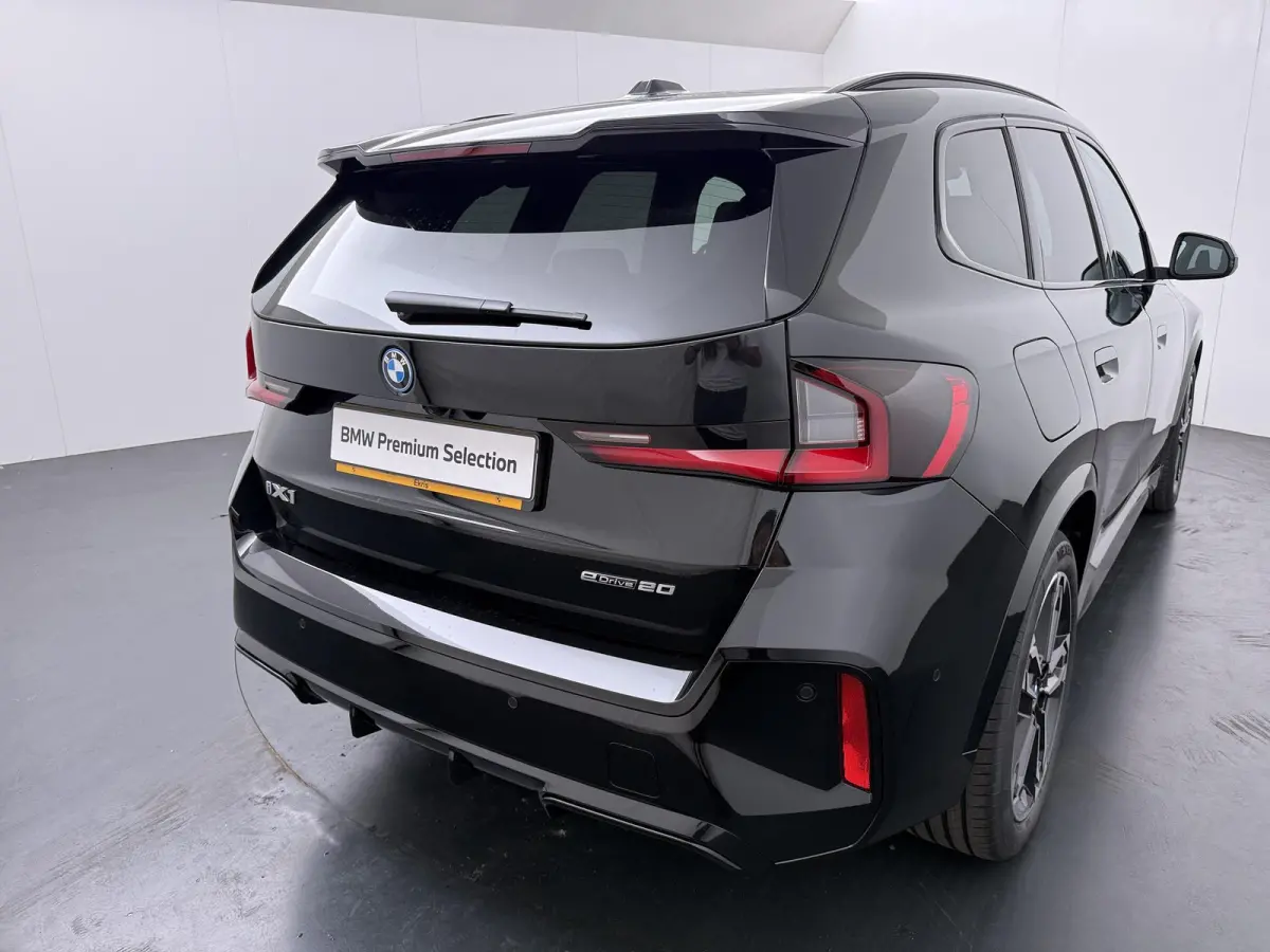 eDrive20 67 kWh M Sport Edition | SoH 100% | Comfort Access | Elektrisch bediende stoel | Massage | Panoramadak | Adaptive Cruise |