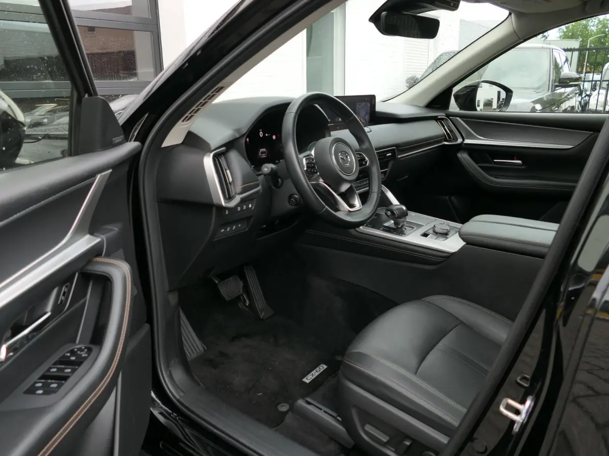 2.5 e-SkyActiv PHEV Homura | Panoramadak | Trekhaak | 360°-camera | BOSE | Memory | Stoelventilatie | Stuur-/Stoelverwarming V+A | Apple-/Android Carplay | Dodehoek detectie | ACC
