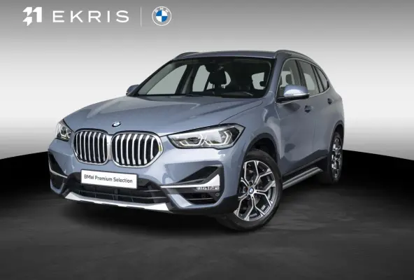 sDrive20i | High Executive | Orange Edition | Achteruitrijcamera | 18 inch | Elektrische achterklep | Navi Plus | Head-Up Display | Trekhaak