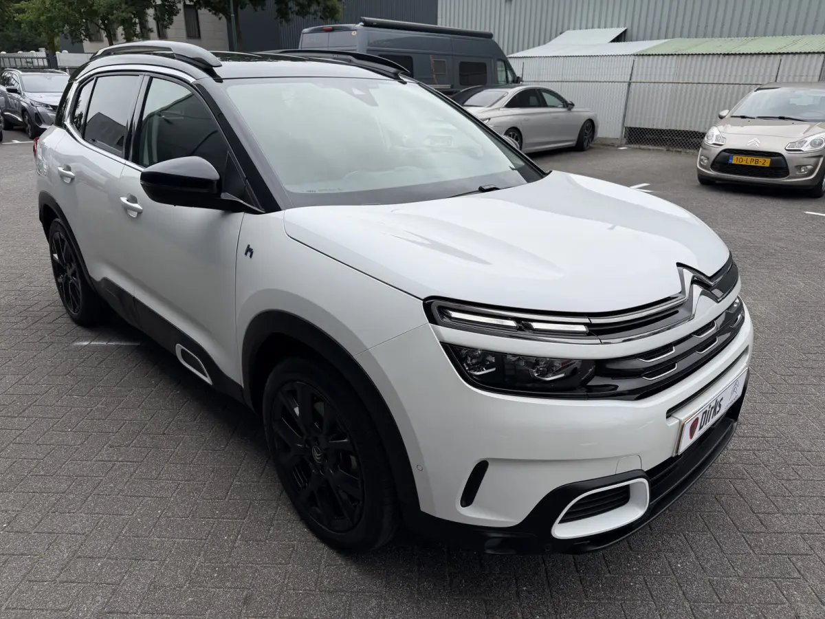 225pk Plug-in Hybrid Shine (Leder incl verwarming/geheugen/massage - Elektrische Klep - 19" Zwart - Adaptieve Cruise Controle - Keyless Entry - Camera)