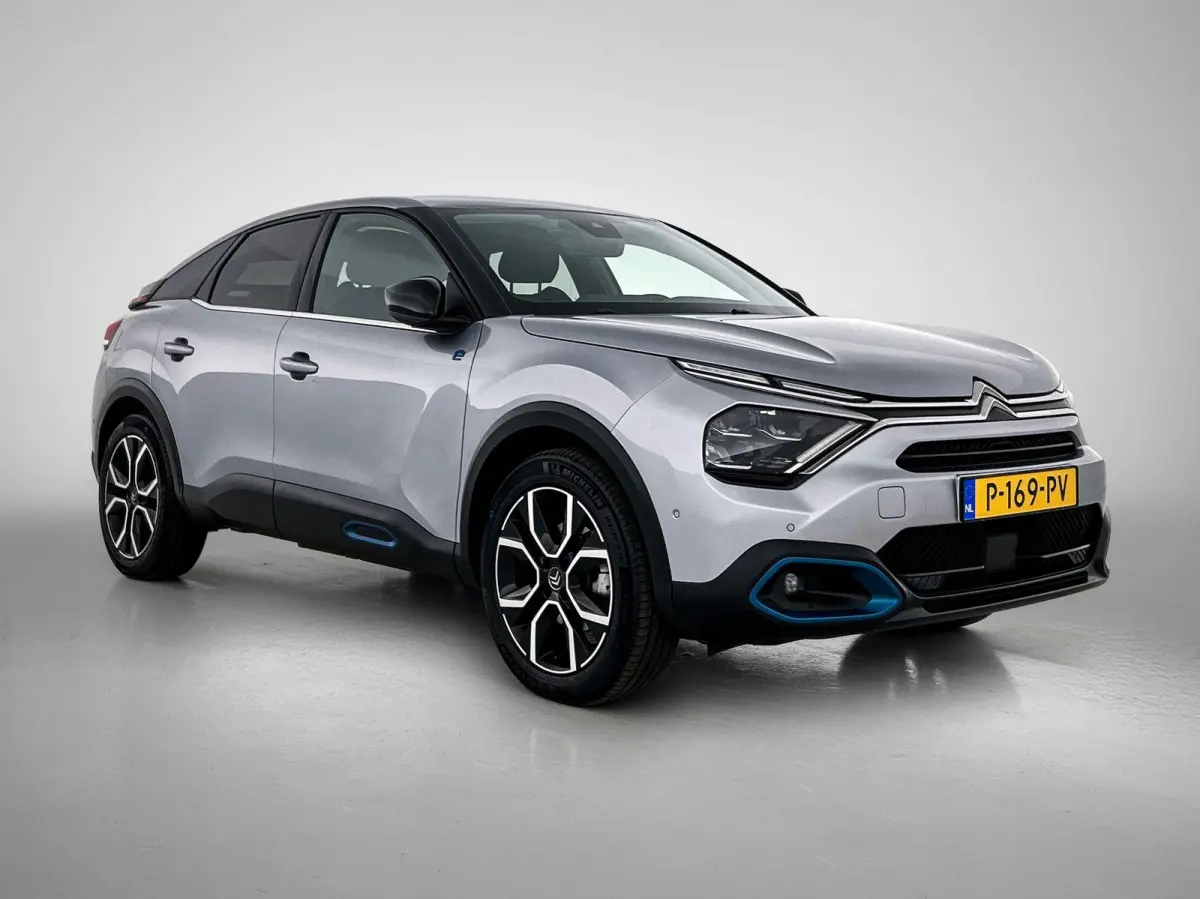 Shine 136pk 50 kWh Automaat | 1ste Eigenaar | Head-Up Display | Navigatie | Winter-Pakket | Climate Control | Adaptieve Cruise Control | Camera | full-LED | 18"LMV |