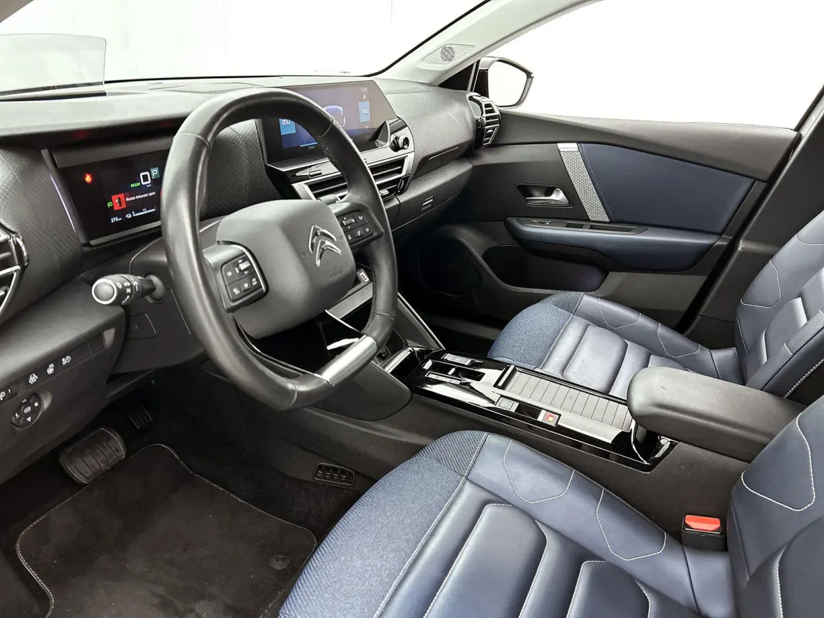 Shine 136pk 50 kWh Automaat | 1ste Eigenaar | Head-Up Display | Navigatie | Winter-Pakket | Climate Control | Adaptieve Cruise Control | Camera | full-LED | 18"LMV |