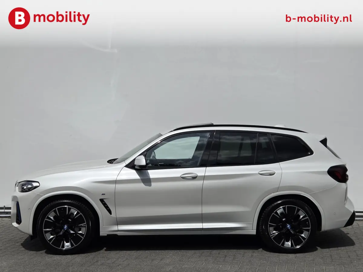 High Executive M-Sport 80 kWh SOH 98% 'Mineral-Weiss' Trekhaak Panoramdak Harman/Kardon | Adaptive Cruise Control | Elek. Stoelen | Head-Up | DAB