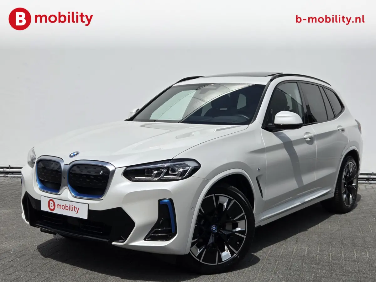 High Executive M-Sport 80 kWh SOH 98% 'Mineral-Weiss' Trekhaak Panoramdak Harman/Kardon | Adaptive Cruise Control | Elek. Stoelen | Head-Up | DAB