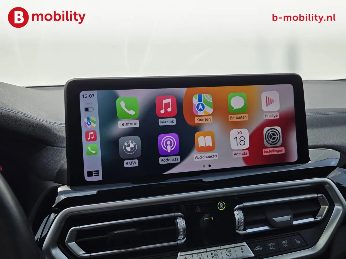 High Executive M-Sport 80 kWh SOH 98% 'Mineral-Weiss' Trekhaak Panoramdak Harman/Kardon | Adaptive Cruise Control | Elek. Stoelen | Head-Up | DAB