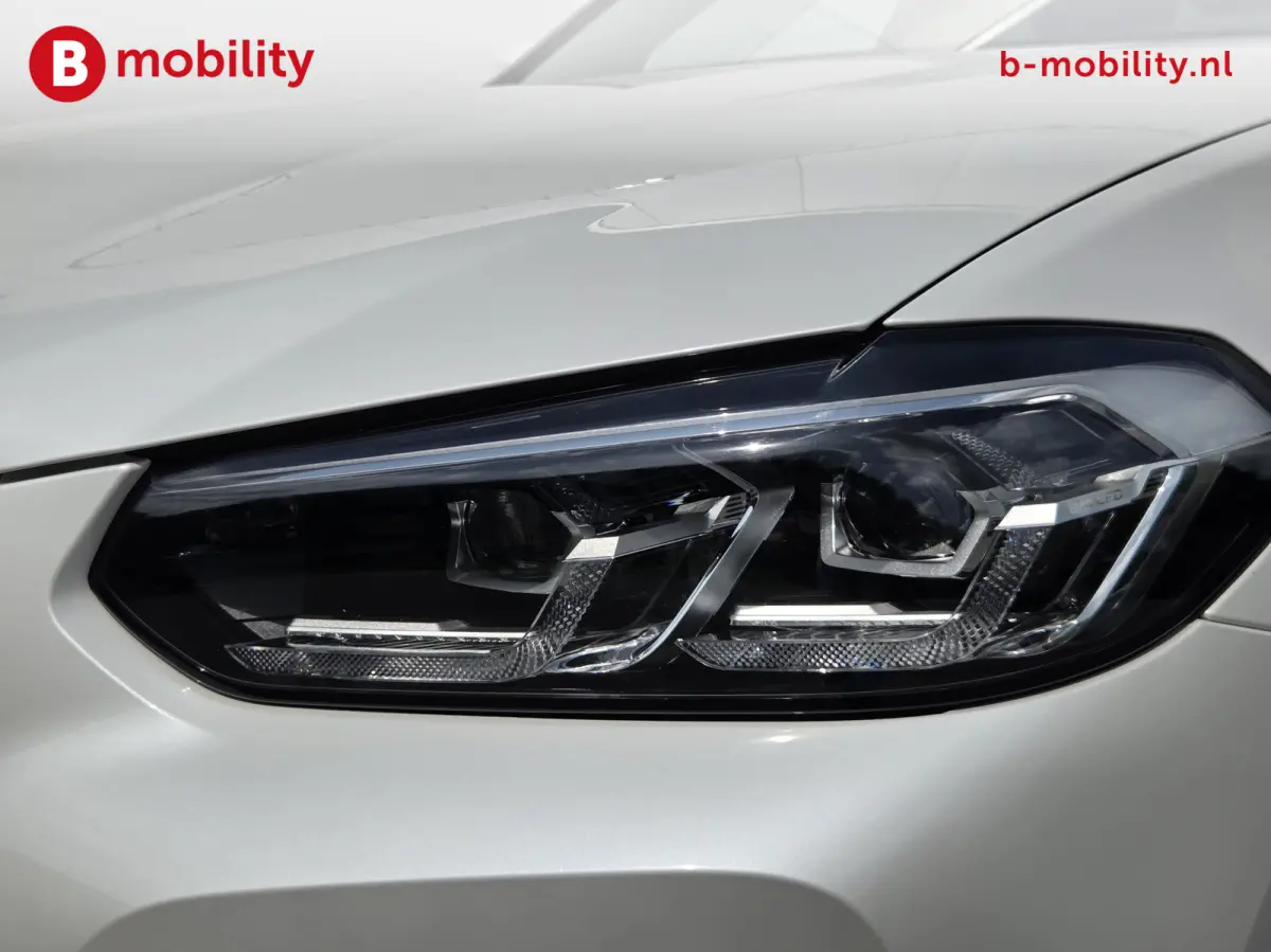 High Executive M-Sport 80 kWh SOH 98% 'Mineral-Weiss' Trekhaak Panoramdak Harman/Kardon | Adaptive Cruise Control | Elek. Stoelen | Head-Up | DAB