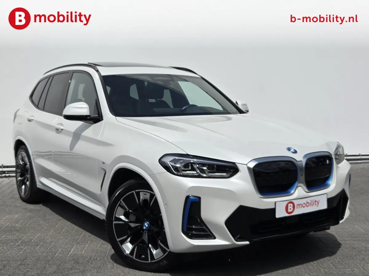 High Executive M-Sport 80 kWh SOH 98% 'Mineral-Weiss' Trekhaak Panoramdak Harman/Kardon | Adaptive Cruise Control | Elek. Stoelen | Head-Up | DAB
