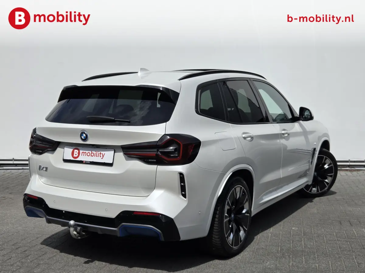High Executive M-Sport 80 kWh SOH 98% 'Mineral-Weiss' Trekhaak Panoramdak Harman/Kardon | Adaptive Cruise Control | Elek. Stoelen | Head-Up | DAB