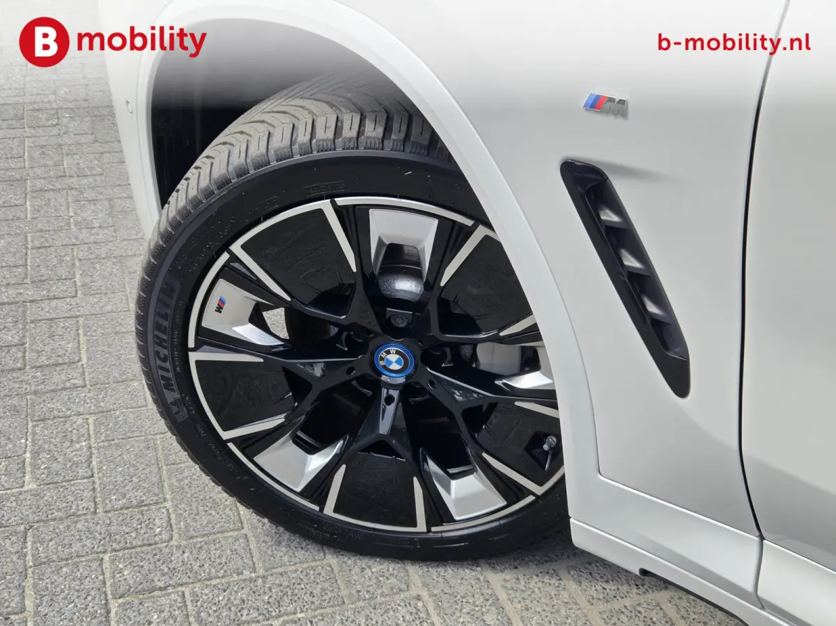 High Executive M-Sport 80 kWh SOH 98% 'Mineral-Weiss' Trekhaak Panoramdak Harman/Kardon | Adaptive Cruise Control | Elek. Stoelen | Head-Up | DAB