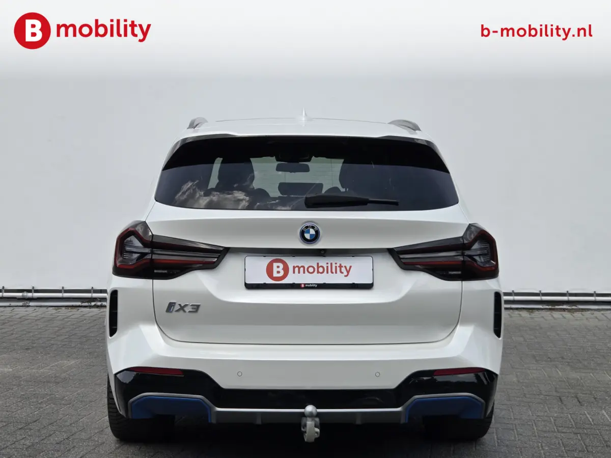 High Executive M-Sport 80 kWh SOH 98% 'Mineral-Weiss' Trekhaak Panoramdak Harman/Kardon | Adaptive Cruise Control | Elek. Stoelen | Head-Up | DAB