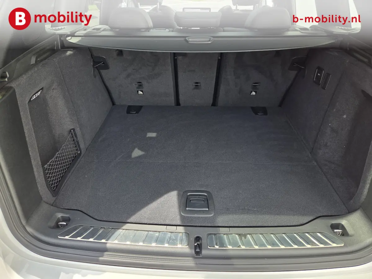 High Executive M-Sport 80 kWh SOH 98% 'Mineral-Weiss' Trekhaak Panoramdak Harman/Kardon | Adaptive Cruise Control | Elek. Stoelen | Head-Up | DAB