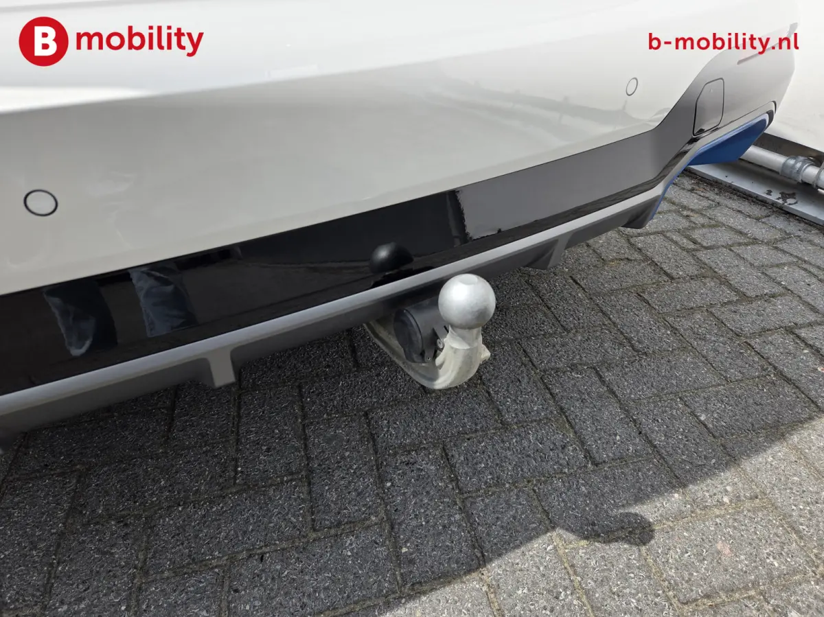 High Executive M-Sport 80 kWh SOH 98% 'Mineral-Weiss' Trekhaak Panoramdak Harman/Kardon | Adaptive Cruise Control | Elek. Stoelen | Head-Up | DAB