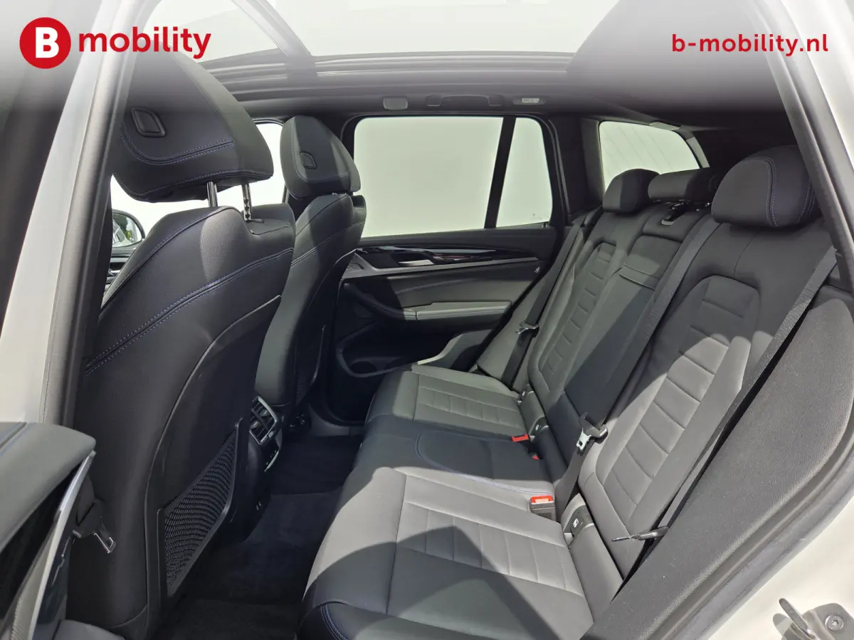 High Executive M-Sport 80 kWh SOH 98% 'Mineral-Weiss' Trekhaak Panoramdak Harman/Kardon | Adaptive Cruise Control | Elek. Stoelen | Head-Up | DAB