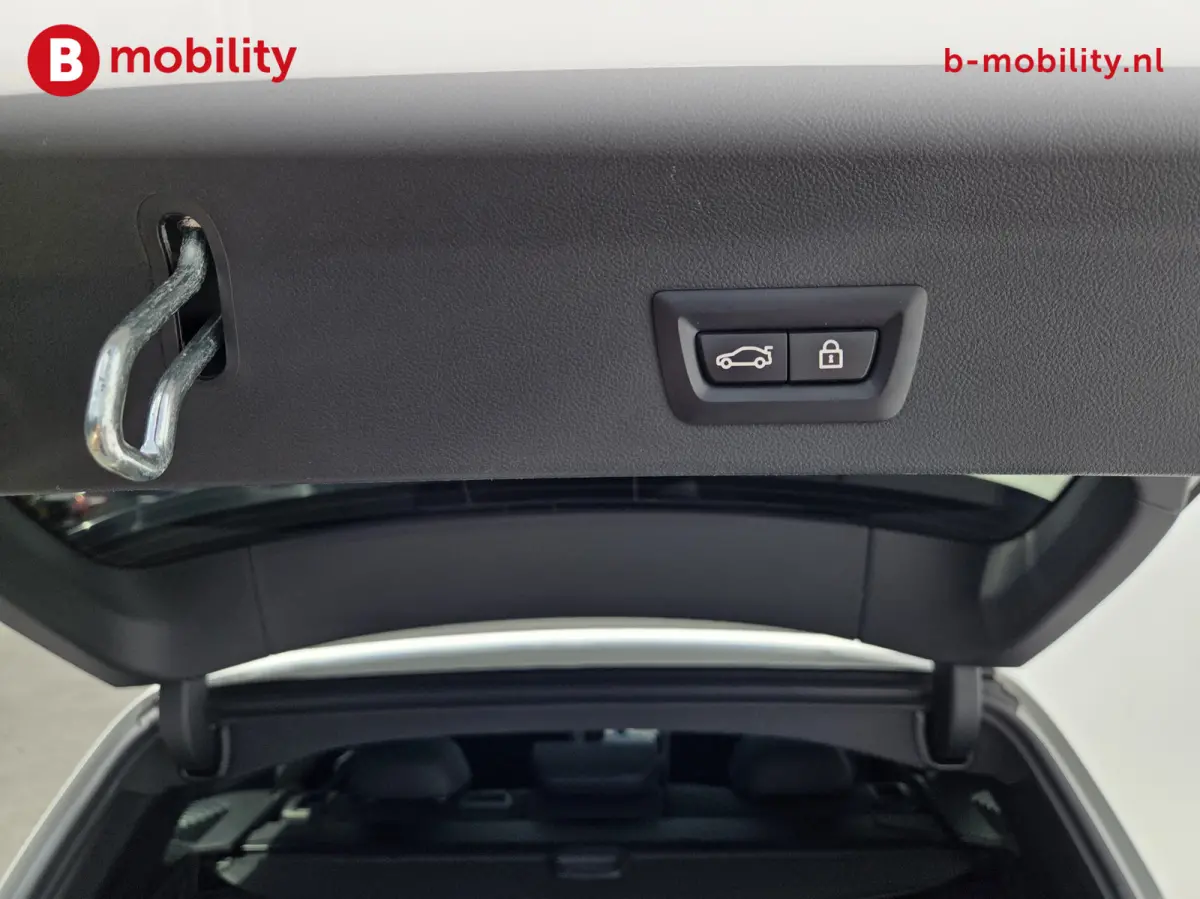 High Executive M-Sport 80 kWh SOH 98% 'Mineral-Weiss' Trekhaak Panoramdak Harman/Kardon | Adaptive Cruise Control | Elek. Stoelen | Head-Up | DAB