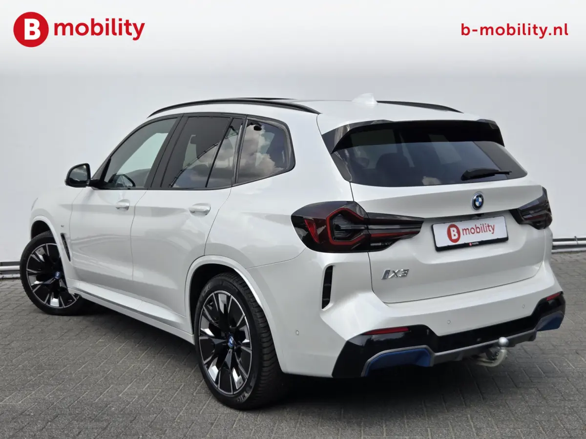 High Executive M-Sport 80 kWh SOH 98% 'Mineral-Weiss' Trekhaak Panoramdak Harman/Kardon | Adaptive Cruise Control | Elek. Stoelen | Head-Up | DAB