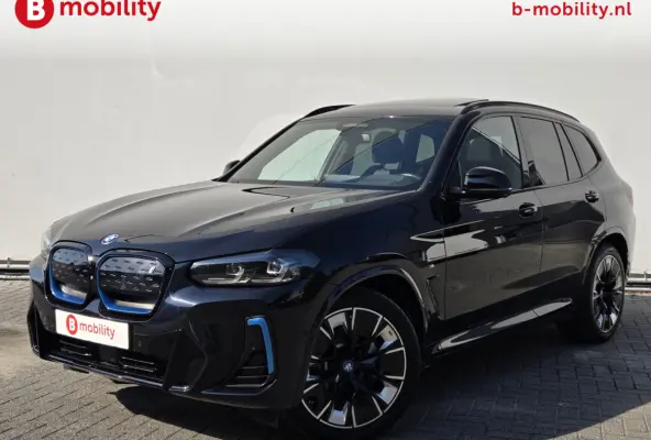 High Executive M-Sport 80 kWh SOH 100% 'Carbon-schwarz' Trekhaak Panoramdak Harman/Kardon | Adaptive Cruise Control | Elek. Stoelen | Head-Up | DAB