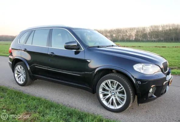 3.5i High Executive M-sportpakket E70 LCI Carbonschwarz Bruin Merino leer Panoramadak Historie