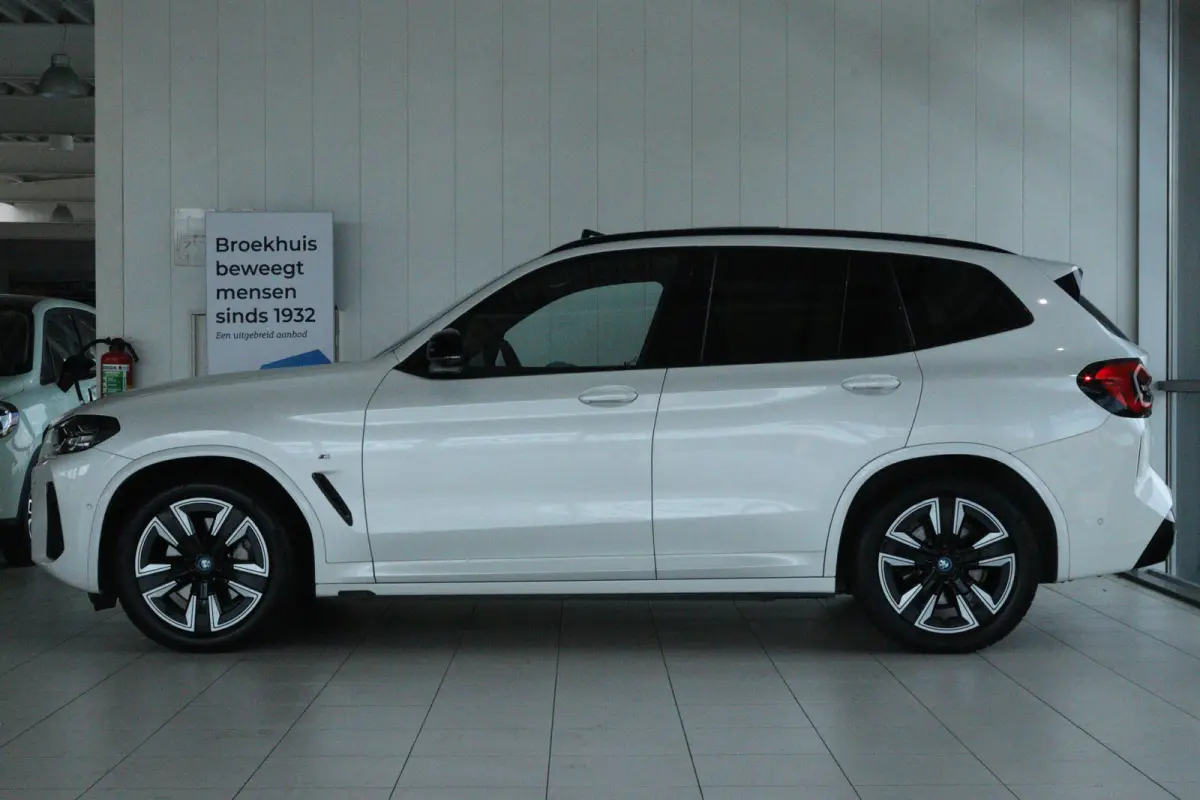 Executive 80 kWh M-Sport | SoH 99% | Adapt. Cruise | Schuifdak | Camera | Memory | Navi | Carplay | Elektr. klep