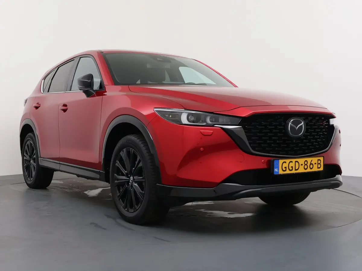 2.0 e-SkyActiv-G M Hybrid 165 Homura | Gevent. Leder | Verwarmde achterbank | Panoramadak | Trekhaak |