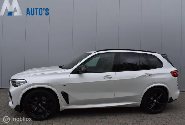 xDrive40i M-Performance Mineralweiß Pano Nappa HUD Softclose H/K Luchtvering 21" LMV Elek. trekhaak