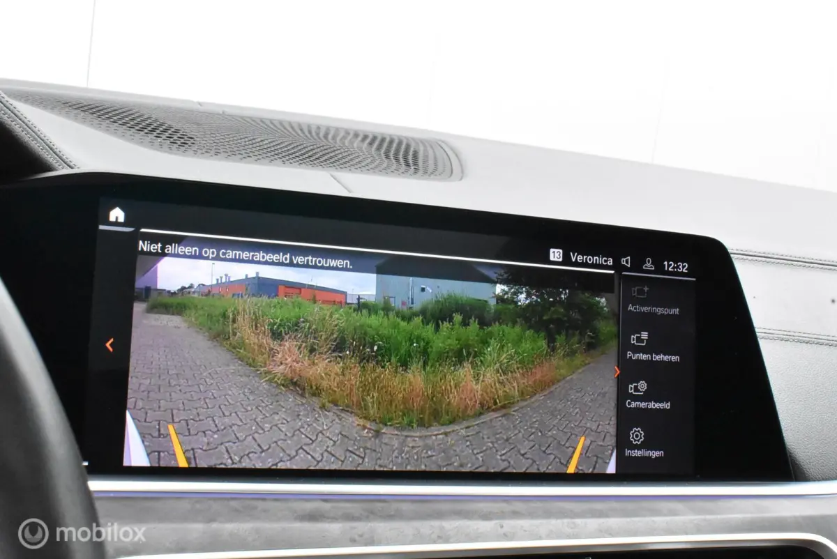 xDrive40i M-Performance Mineralweiß Pano Nappa HUD Softclose H/K Luchtvering 21" LMV Elek. trekhaak