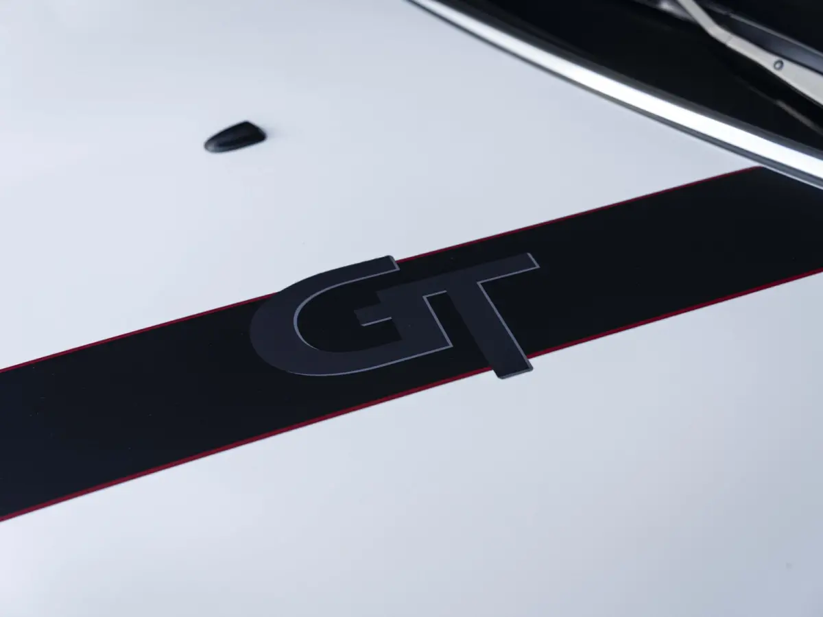 Cooper Rockingham GT | JCW-pakket | Adaptief onderstel | Stuur & Stoelverwarming | Achteruitrijcamera | Head-Up Display | Glazen panoramadak |