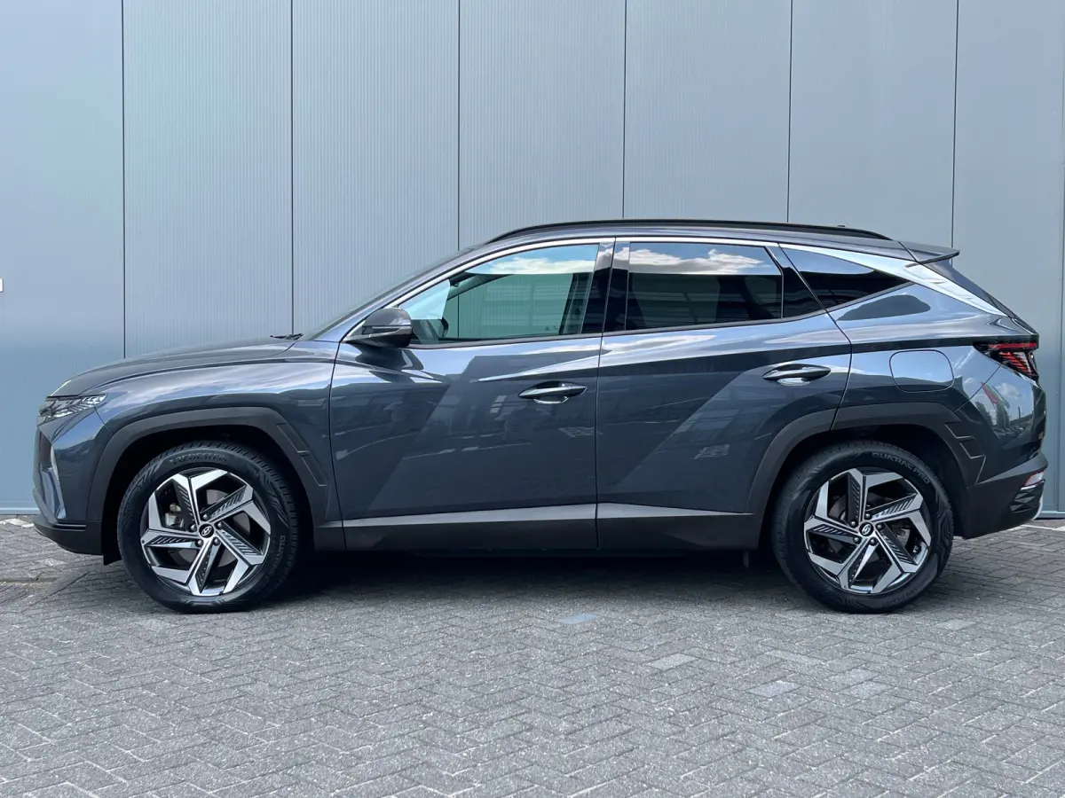 1.6 T-GDI 265pk PHEV Comfort Smart 4WD | Climate | Camera | Carplay | Keyless | Navigatie | Full - Led | Elek. Klep | Winterpakket | 19" Lichtmetaal | Krell Audio | Digitale Cockpit | Parkee