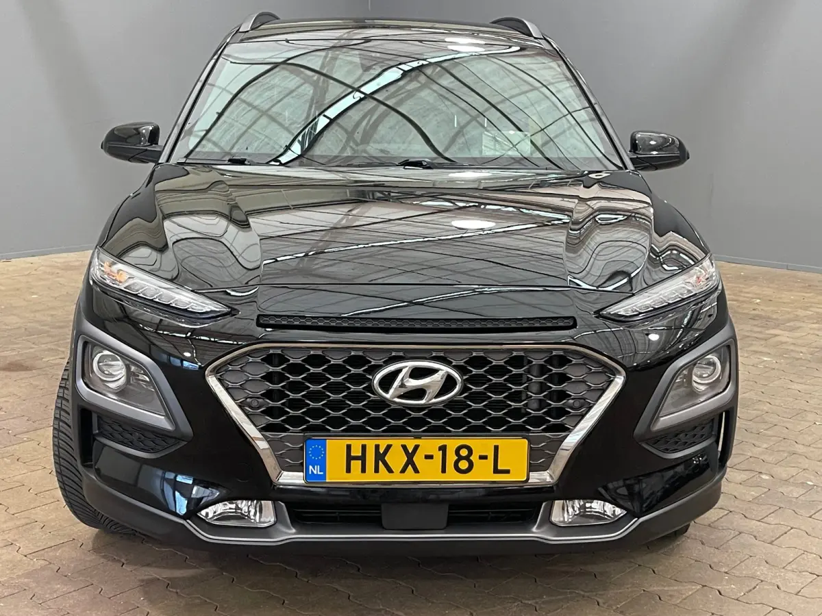 1.6 T-GDI Premium | Head up display | Achteruitrijcamera | Stoelverwarming + stuurwiel verwarming | Krell Audio | Lime Colour Pack | Achteruitrijcamera | Airco (automatisch) | Apple Carplay/