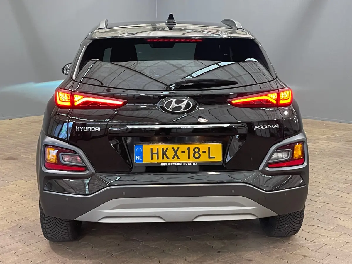 1.6 T-GDI Premium | Head up display | Achteruitrijcamera | Stoelverwarming + stuurwiel verwarming | Krell Audio | Lime Colour Pack | Achteruitrijcamera | Airco (automatisch) | Apple Carplay/