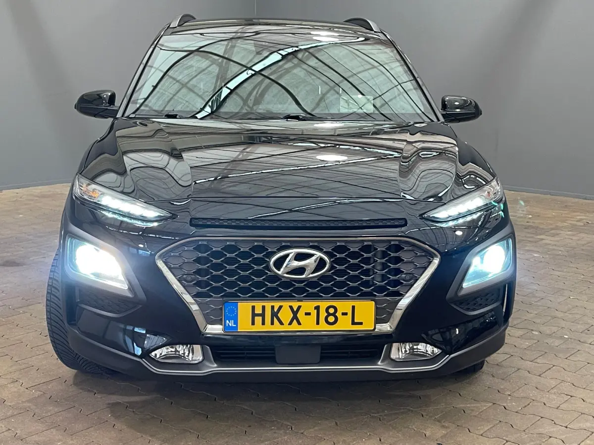 1.6 T-GDI Premium | Head up display | Achteruitrijcamera | Stoelverwarming + stuurwiel verwarming | Krell Audio | Lime Colour Pack | Achteruitrijcamera | Airco (automatisch) | Apple Carplay/