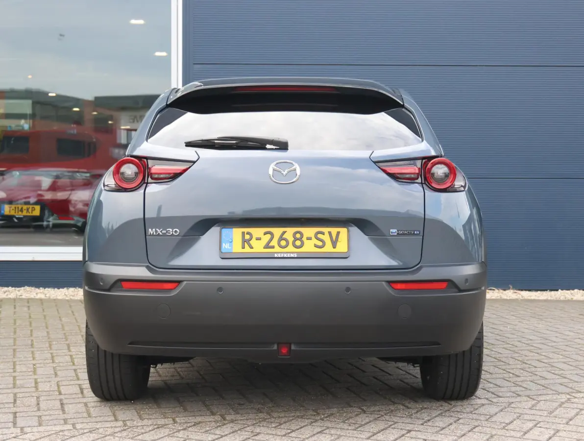 e-SkyActiv EV 145 Advantage 36 kWh Camera | ACCU 95% | Elektrisch verstelbare stoelen | LEER | Stoelverwarming | Navigatie | Climate Control Tweezeidig | Apple CarPlay & Android Auto