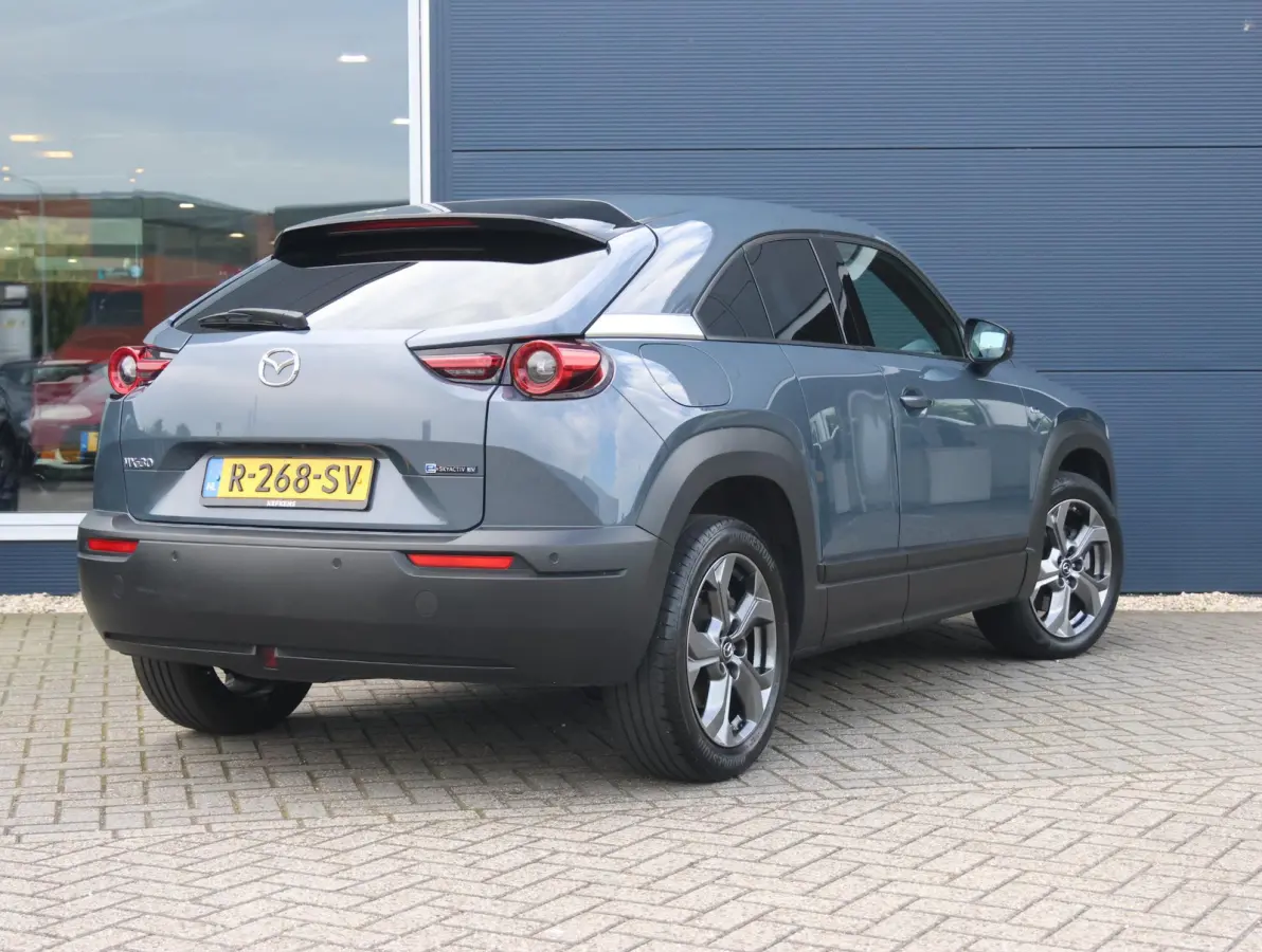 e-SkyActiv EV 145 Advantage 36 kWh Camera | ACCU 95% | Elektrisch verstelbare stoelen | LEER | Stoelverwarming | Navigatie | Climate Control Tweezeidig | Apple CarPlay & Android Auto