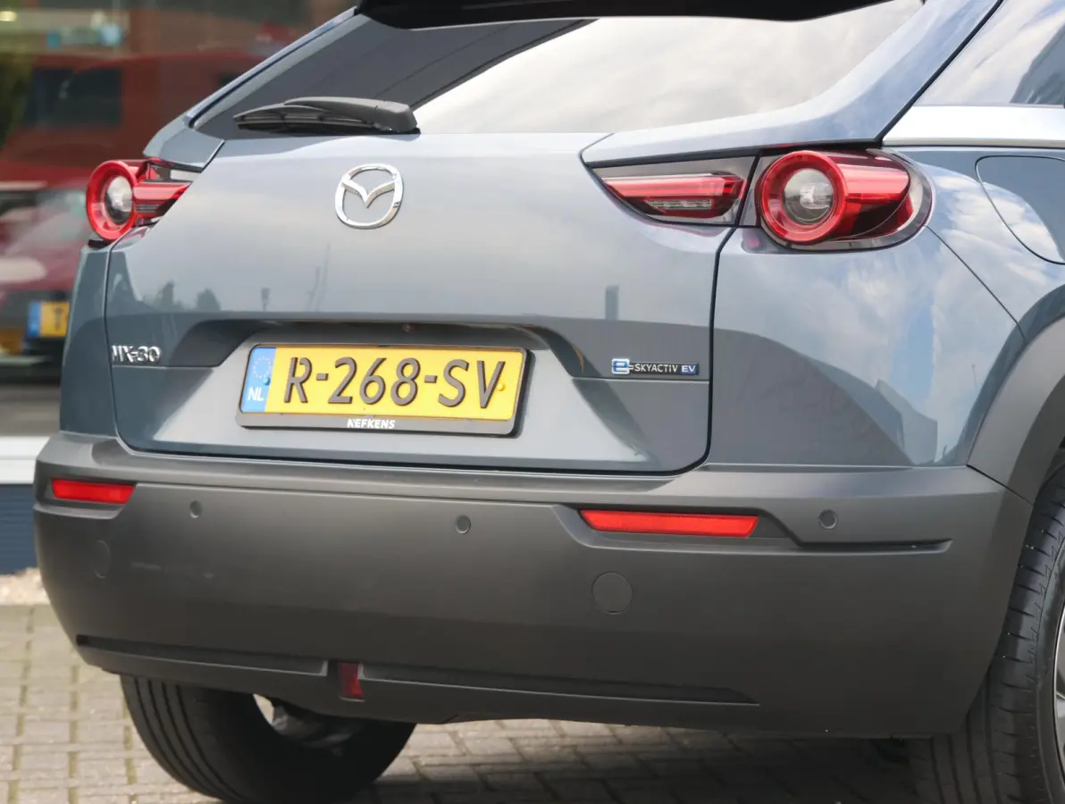 e-SkyActiv EV 145 Advantage 36 kWh Camera | ACCU 95% | Elektrisch verstelbare stoelen | LEER | Stoelverwarming | Navigatie | Climate Control Tweezeidig | Apple CarPlay & Android Auto