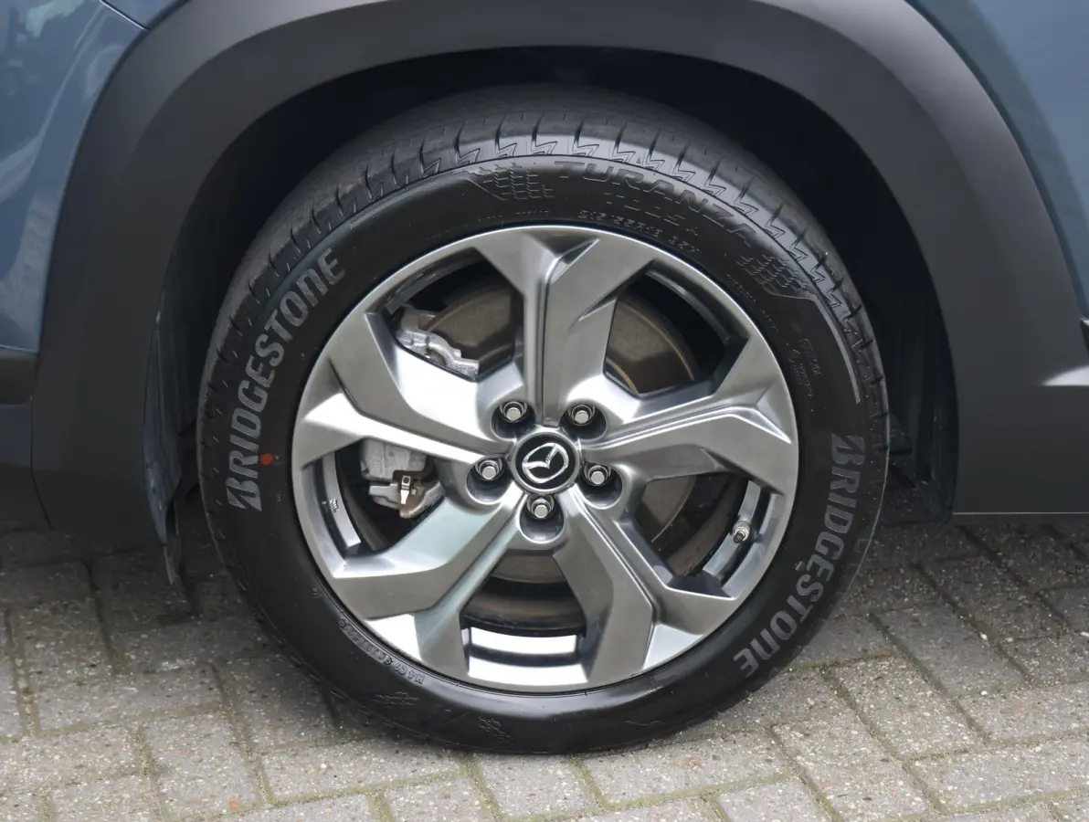 e-SkyActiv EV 145 Advantage 36 kWh Camera | ACCU 95% | Elektrisch verstelbare stoelen | LEER | Stoelverwarming | Navigatie | Climate Control Tweezeidig | Apple CarPlay & Android Auto