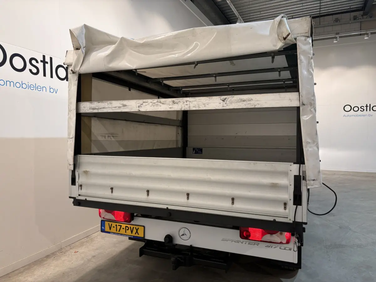 317 CDI L2 RWD DC Open Laadbak met Huif en schuifzeilen / Airco / Cruise / Mbux / Trekhaak