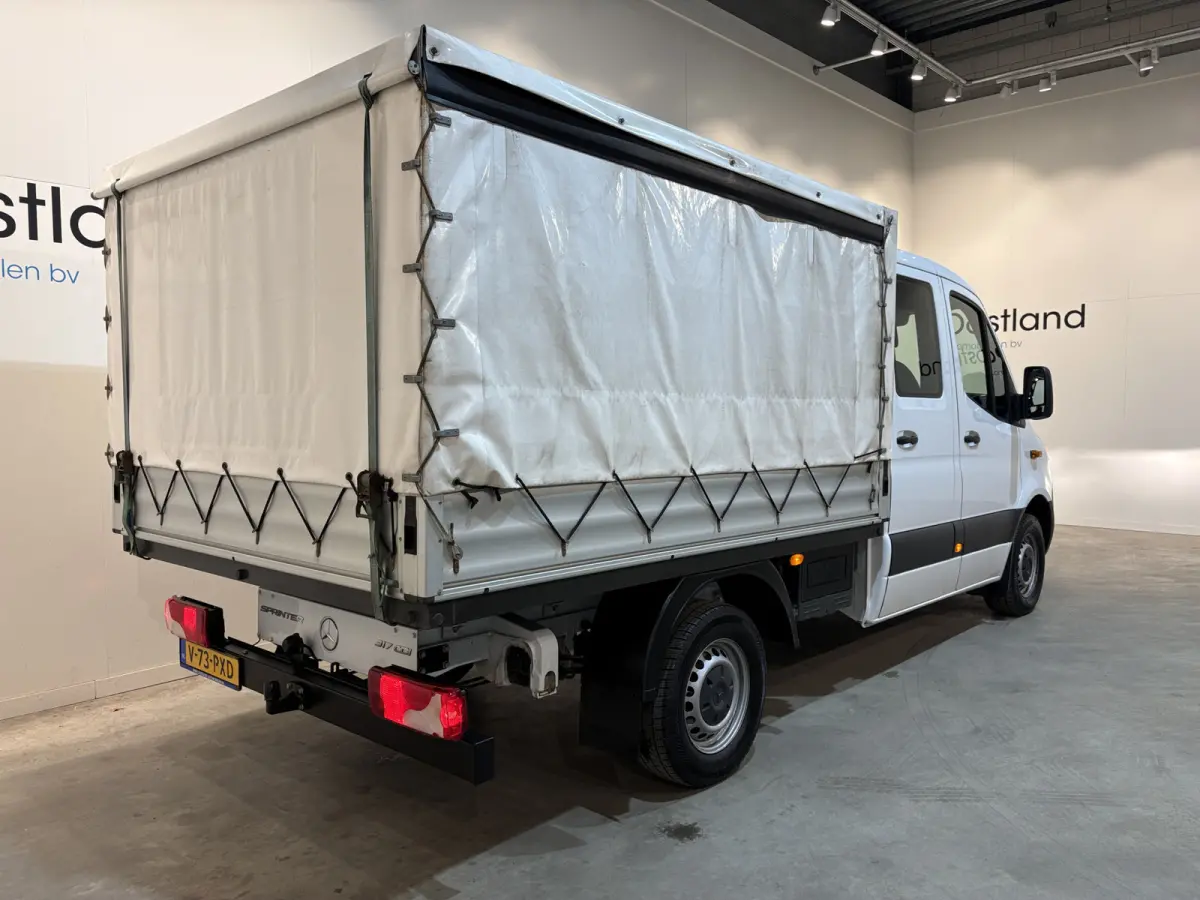 317 CDI L2 RWD DC Open Laadbak met Huif en schuifzeilen / Airco / Cruise / Mbux / Trekhaak